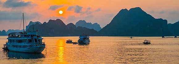 Halong Bay has approximately how many Islets rising from it's emerald waters?